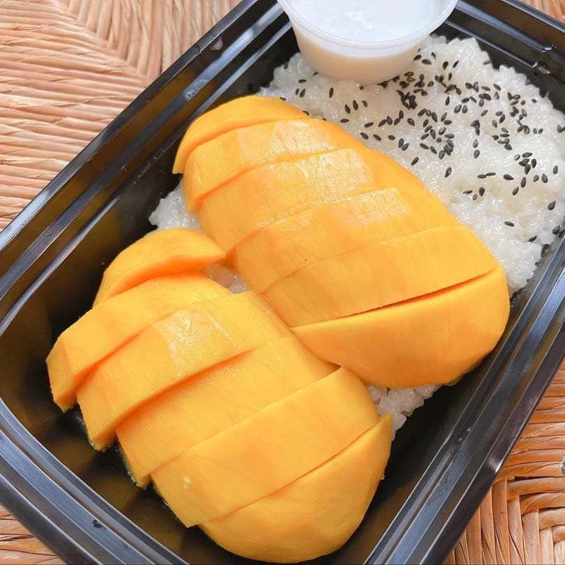 Barnrau Thai Halal Cuisine's mango sticky rice with black sesame seeds and coconut milk.